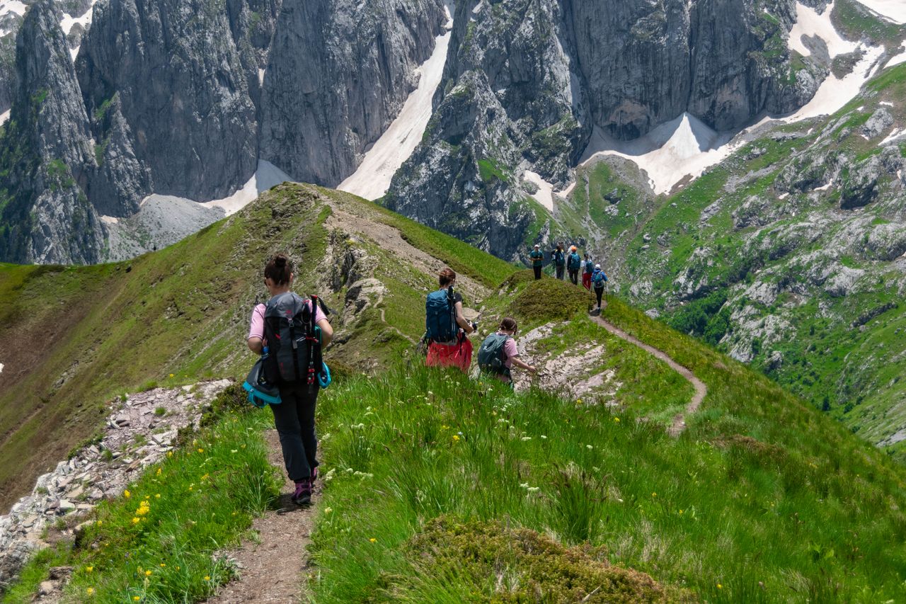A group of hikers exploring the breathtaking mountain trails of Montenegro.
